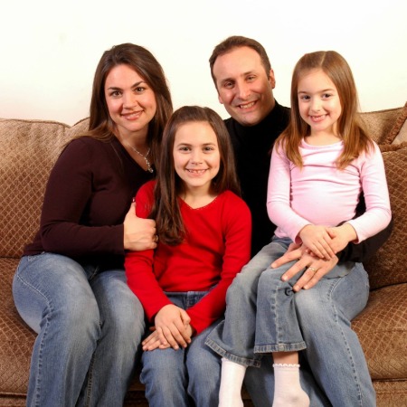 Toni Ann Gisondi with her husband and two daughters.